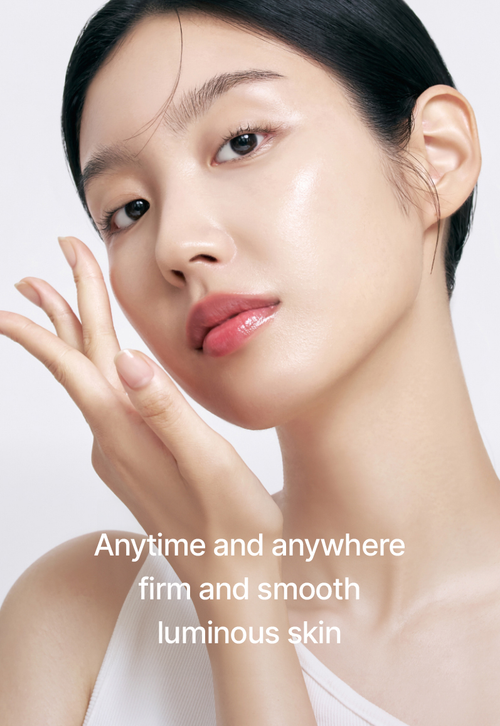 Woman with smooth skin touching her face against a white background
