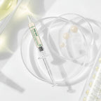 Skincare product with syringe and pearls on a soft white background