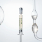 Skincare serum in a syringe with a blurred background