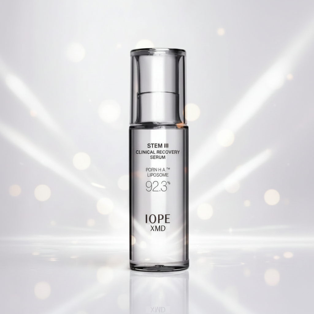 IOPE STEM III Clinical Recovery Serum bottle on a reflective surface with blurred lights in the background